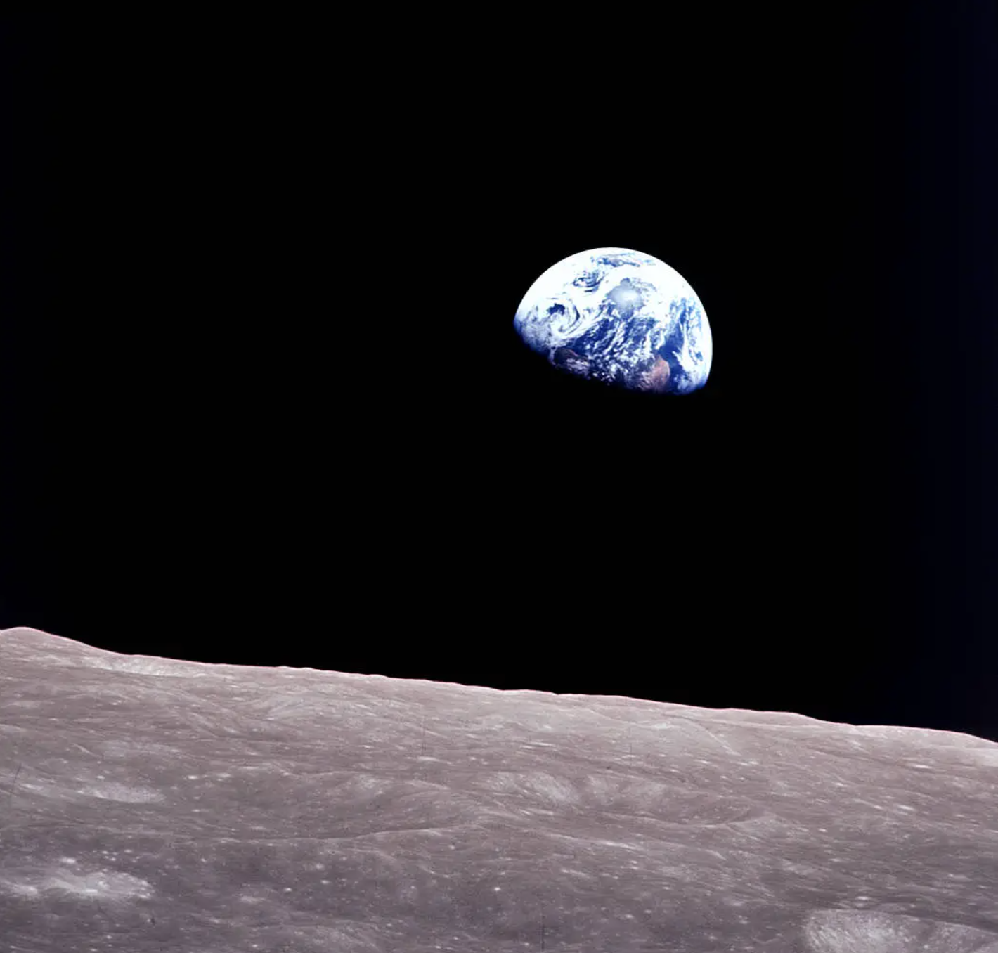 Earthrise is a photograph of Earth and part of the Moon's surface that was taken from lunar orbit by astronaut William Anders on December 24, 1968, during the Apollo 8 mission.